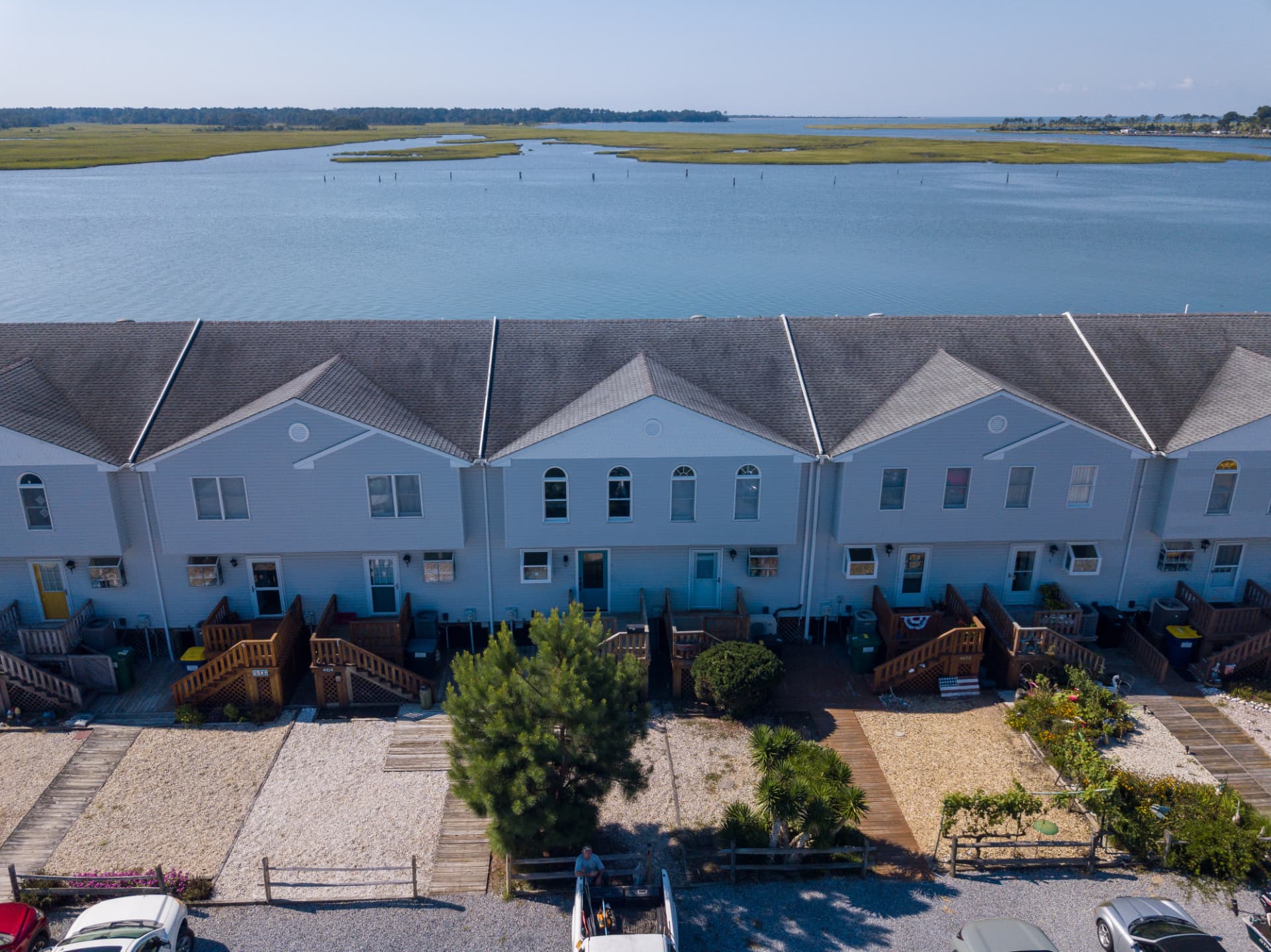 Aerial view of Channel Landing townhomes with the channel, water, and Assateague Island in the background